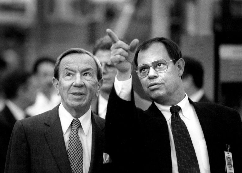 Boeing president Phil Condit, right, makes a point to Secretary of State Warren Christopher, during a tour of a Boeing plant where moving parts of the new Boeing 777 were being tested. (Tom Reese / The Seattle Times, 1993)