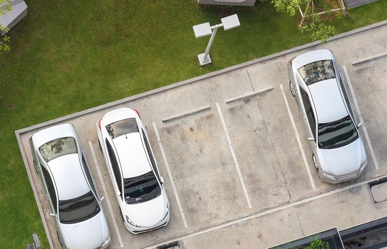 Whether bundled into rent or purchase price, parking is costly. (Dreamstime / TNS)