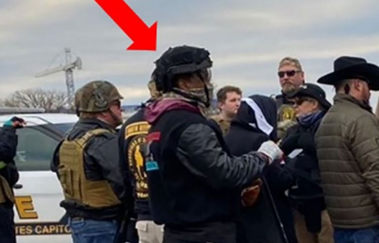 A man identified by authorities as James Beeks, red arrow, allegedly wore a Michael Jackson jacket on the day of the attack on the Capitol on Jan. 6 by a pro-Trump mob. Beeks, a star of “Jesus Christ Superstar,” has been arrested and charged. MUST CREDIT: Justice Department.