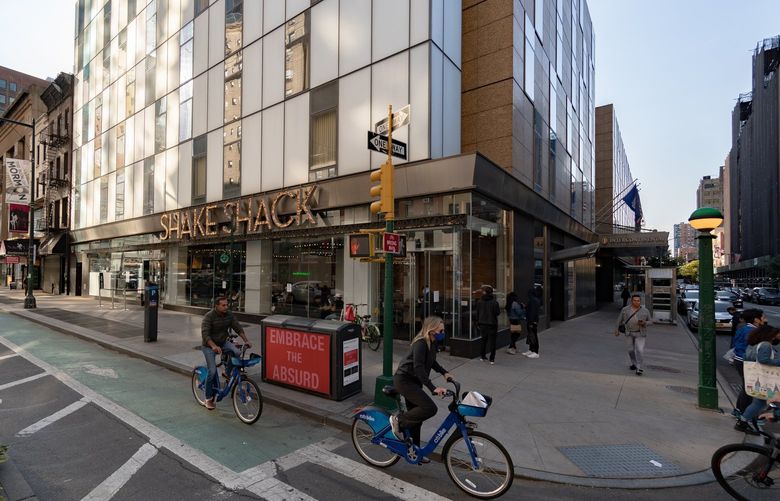 FILE -The Shake Shack location on Times Square in Manhattan, Oct. 4, 2020. Shake Shack is among the companies that have experimented with the four-day workweek, a long-touted development that may finally be at hand. (Jeenah Moon/The New York Times) XNYT224 XNYT224