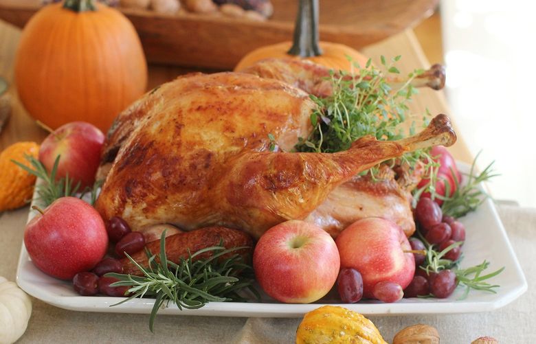 This Oct. 12, 2015, photo shows a roasted Thanksgiving turkey in Concord, N.H. Regardless of how you cook the turkey, experts say to make sure you let it sit, undisturbed, on a cutting board or platter for at least 30 minutes before carving. This allows the bird to finish cooking more gently and reabsorb all of its juices, producing moist meat. (AP Photo/Matthew Mead)