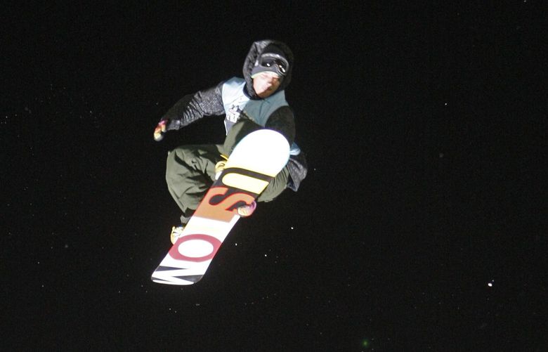Marko Grilc of Sovenia in action in a best trick competition during the snowboard and ski freestyle festival at Battersea Power Station in London, Friday, Oct. 30, 2009. Snowboarders are to compete in the International Ski Federation (FIS) World Cup big air competition on Saturday. (AP Photo/Sang Tan)