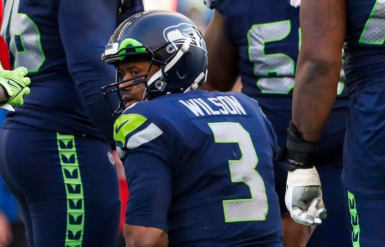 Lumen Field – Seattle Seahawks vs. Arizona Cardinals – 112121
Seattle Seahawks quarterback Russell Wilson looks back towards the sideline during the second quarter Sunday, Nov. 21, 2021, in Seattle. 218880