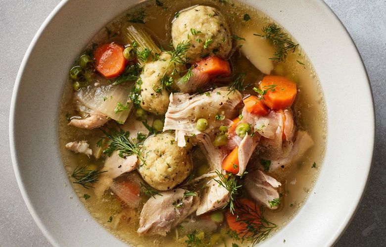 Chicken matzo ball stew in New York, Nov. 10, 2021. This light recipe is still filling and festive enough for Hanukkah, and it’s easy to clean up, too. Food styled by Simon Andrews. (Johnny Miller/The New York Times) XNYT96 XNYT96