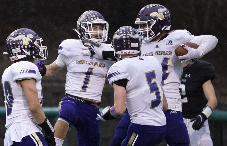 Members of the Lake Stevens football team celebrate a touchdown at the WIAA 4A state semifinal football game between Lake Stevens and Eastlake at Pop Keeney Stadium in Bothell on Saturday, Nov. 27, 2021.
