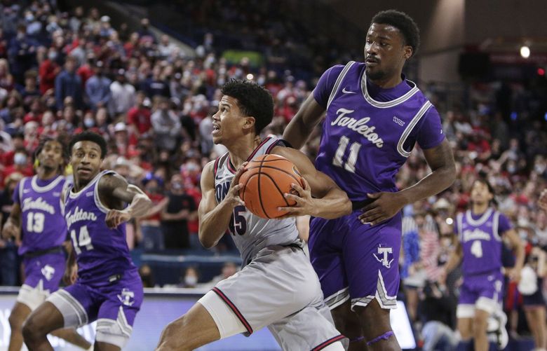 Gonzaga guard Rasir Bolton, left, drives to the basket past Tarleton State guard Montre Gipson during the first half of an NCAA college basketball game, Monday, Nov. 29, 2021, in Spokane, Wash. (AP Photo/Young Kwak) WAYK108 WAYK108
