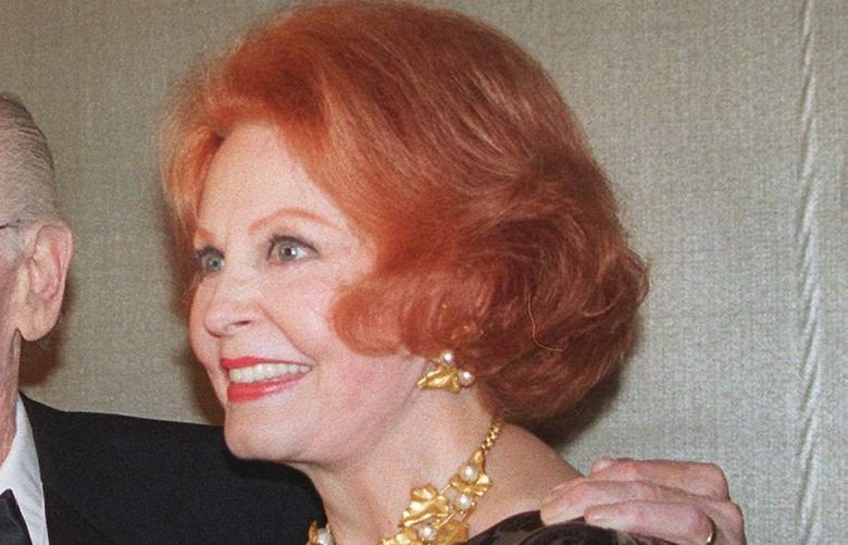Comedian and living legend Milton Berle, center, holds his Lifetime Achievement Award from the New York Television Academy at the Waldorf Astoria hotel in Manhattan borough of New York Monday, Oct. 28, 1996. Berle is joined by actresses Bea Arthur, left, and Arlene Dahl. (AP Photo/Larry LeVine)