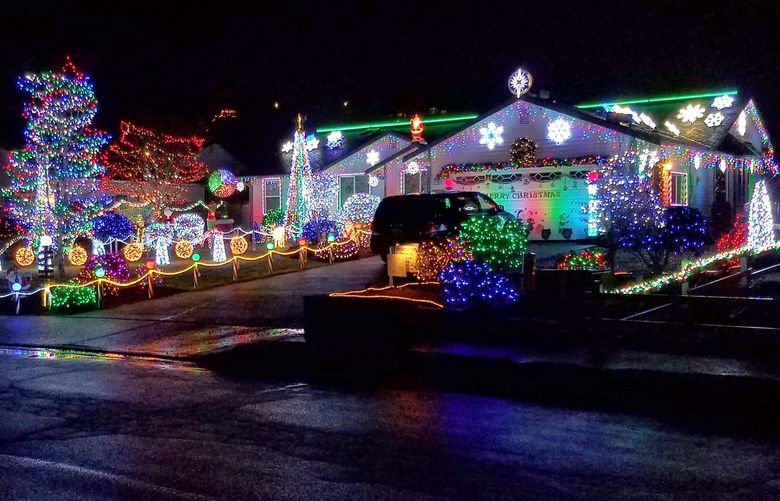 The holiday light display at the home of Dennis Warren of Marysville is one of many featured in Jason and Diana Pittman’s project, Pacific NW Christmas Lights.