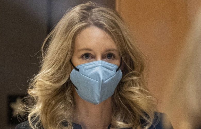 Elizabeth Holmes, founder of Theranos Inc., arrives at federal court in San Jose, California, U.S., on Monday, Nov. 22, 2021. Holmes targeted ultra-wealthy families as early backers of Theranos to avoid the potential pressure from larger investment firms to go public, according to an investor at the DeVos family office who kicked in $100 million for the blood-testing startup.