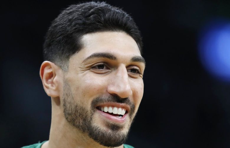 FILE – Boston Celtics’ Enes Kanter smiles before an NBA basketball game against the Toronto Raptors, on Oct. 22, 2021, in Boston. The Celtics center changed his name from Enes Kanter, to Enes Kanter Freedom, in celebration of him officially becoming a United States citizen on Monday, Nov. 29, 2021. (AP Photo/Michael Dwyer, File) NYDD202 NYDD202