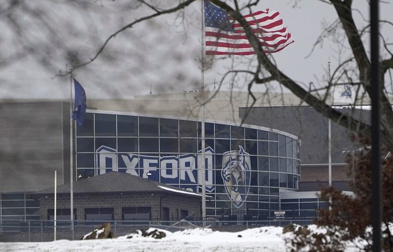 Oxford High School is shown in Oxford, Mich., Tuesday, Nov. 30, 2021, where authorities say a student opened fire at the school. (AP Photo/Paul Sancya) MIPS102 MIPS102