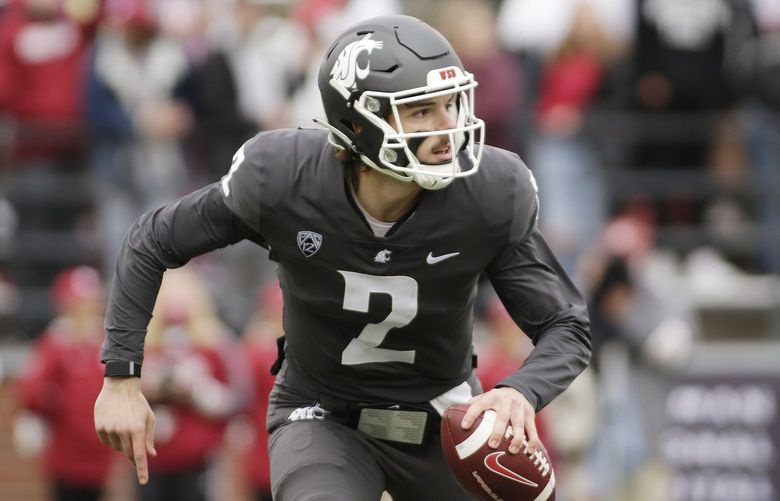 Washington State quarterback Cammon Cooper carries the ball during the second half of an NCAA college football game against Southern California, Saturday, Sept. 18, 2021, in Pullman, Wash. (AP Photo/Young Kwak)
