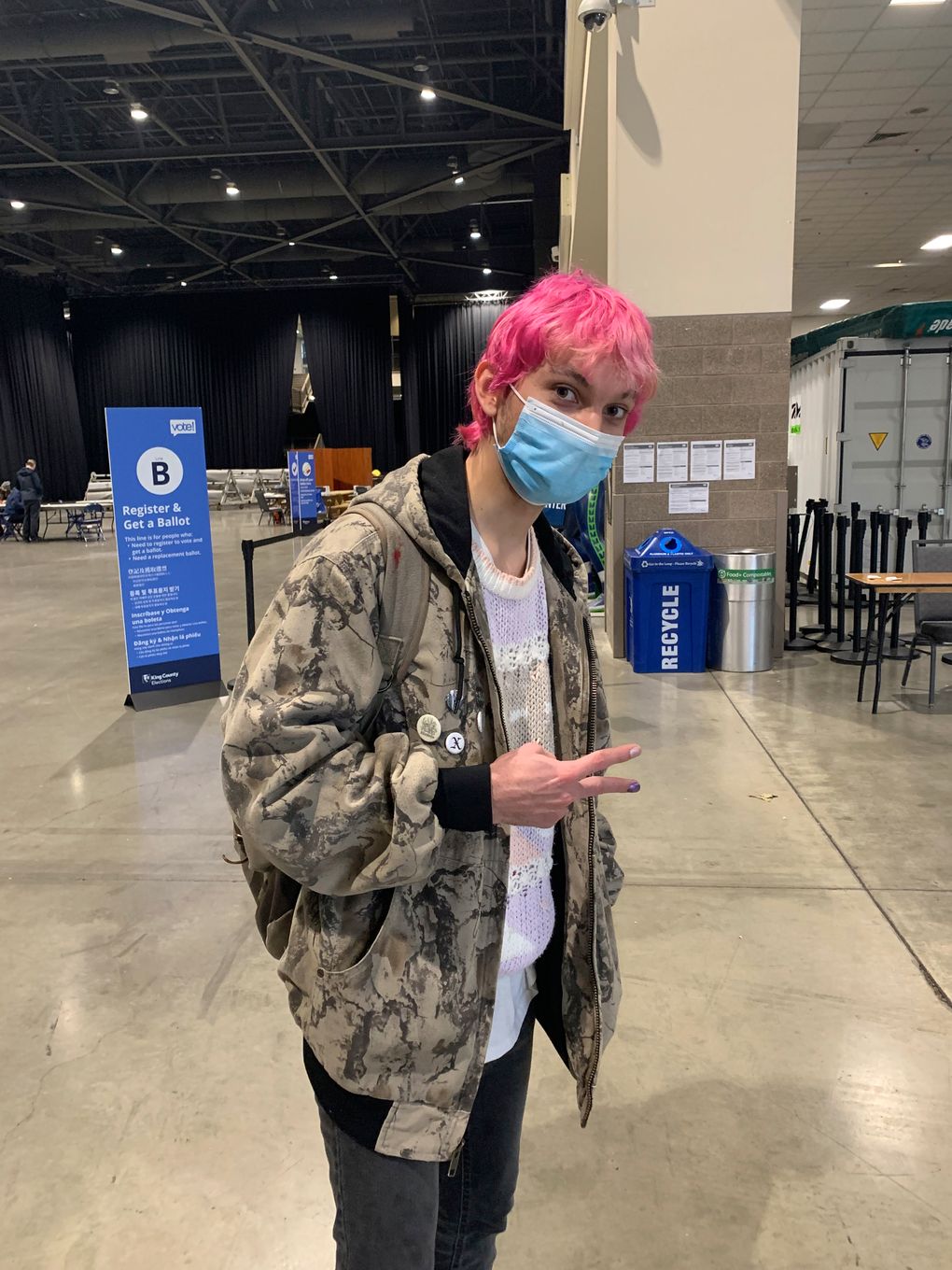 Miguel Ramos, 23, works part time at a café and is studying computer science and illustration at the University of Washington. He voted Tuesday at Lumen Field Event Center. (Anna Patrick / The Seattle Times)
