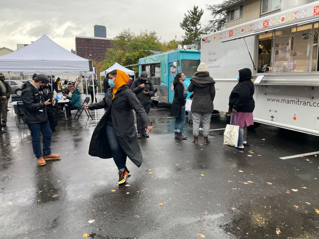 City Council candidate Nikkita Oliver darts across the rainy parking lot of their election day campaign event at Washington Hall in the Central District. (Sydney Brownstone / The Seattle Times)