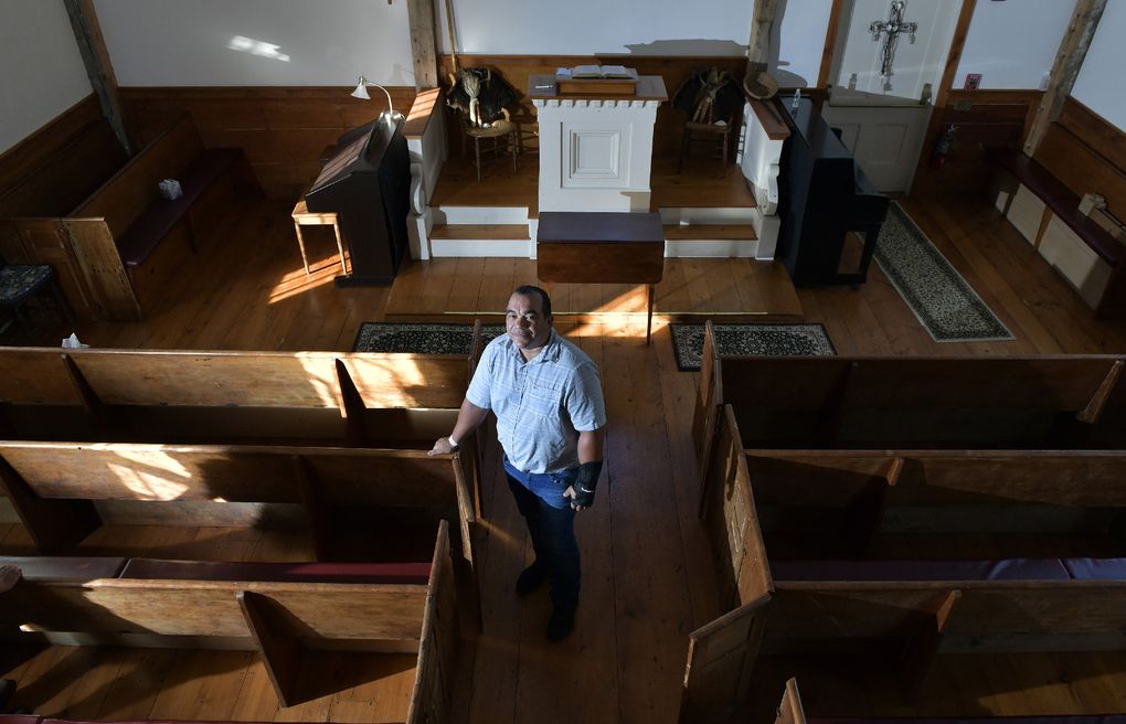 Darius Coombs, a Mashpee Wampanoag who serves as the tribe’s cultural and outreach coordinator, stands in the old Indian Meeting House in Mashpee, Mass., on Sept. 29. (Photo for The Washington Post by Josh Reynolds)