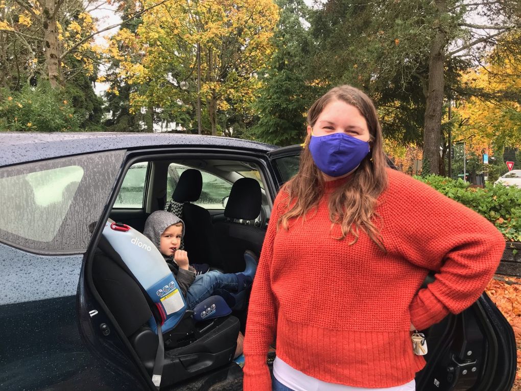 Barbara Alfeo made her way to a ballot drop box near the North Seattle College on Tuesday with her two kids. She said voting and getting leaders to care about environmental justice is where real change begins. (Daisy Zavala / The Seattle Times)