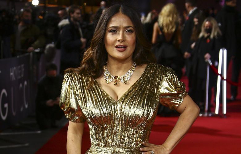 Salma Hayek poses for photographers upon arrival at the World premiere of the film ‘House of Gucci’ in London Tuesday, Nov. 9, 2021. (Photo by Joel C Ryan/Invision/AP) LENT126 LENT126