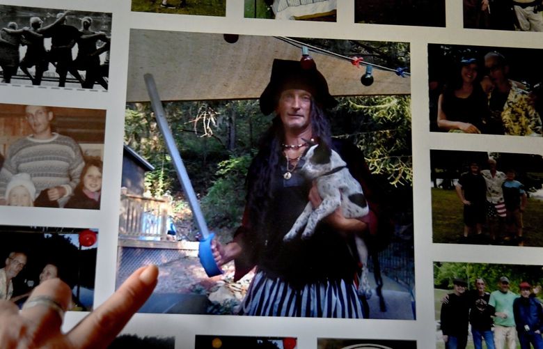 Laurel Haught holds a photo of her husband, Joel, who enjoyed pirate-themed gatherings. MUST CREDIT: Washington Post photo by Michael S. Williamson