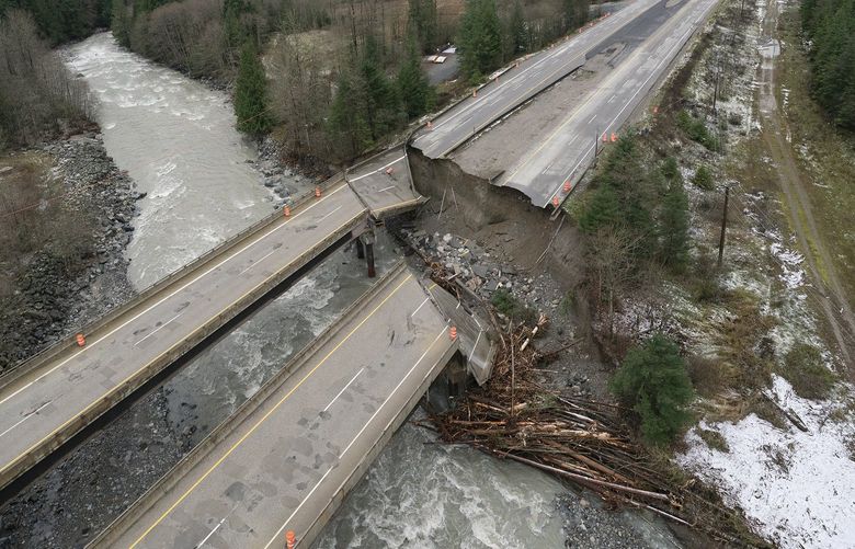 In this aerial image, damage caused by heavy rains and mudslides earlier in the week is pictured along the Coquihalla Highway near Hope, British Columbia, Thursday, Nov. 18, 2021. (Jonathan Hayward/The Canadian Press via AP) JOHV101 JOHV101