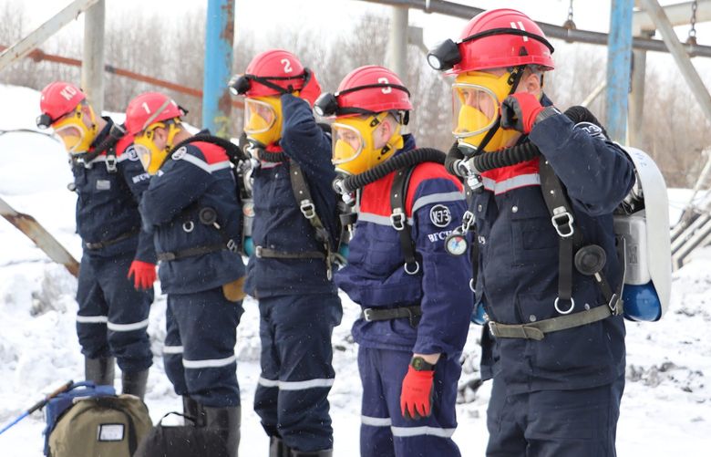 In this Russian Emergency Situations Ministry Thursday, Nov. 25, 2021 photo, rescuers prepare to work at a fire scene at a coal mine near the Siberian city of Kemerovo, about 3,000 kilometres (1,900 miles) east of Moscow, Russia,. Russian authorities say a fire at a coal mine in Siberia has killed nine people and injured 44 others. Dozens of others are still trapped. A Russian news agency says the blaze took place in the Kemerovo region in southwestern Siberia. (Russian Ministry for Emergency Situations photo via AP) XPAG101 XPAG101