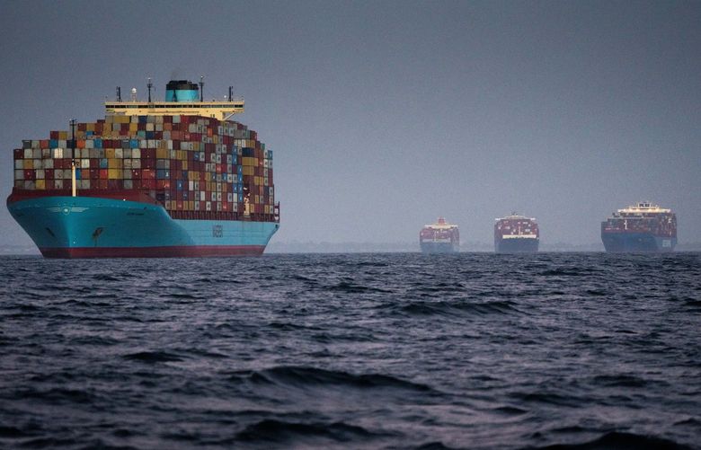 FILE – Container ships waiting to enter the Port of Los Angeles, Oct. 17, 2021. Rising prices for gas and a holiday meal could come back to bite Democrats, who fear that inflation may upend their electoral prospects in the 2022 midterms. (Erin Schaff/The New York Times)
