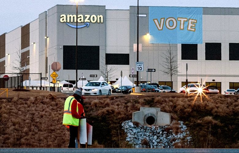 FILE — Labor organizers promote the Retail Wholesale and Department Store Union, outside an Amazon warehouse in Bessemer, Ala., on March 12, 2021. After an election defeat in Alabama, many in labor are shifting strategies, wary of the challenges and expense of winning votes site by site. (Bob Miller/The New York Times) XNYT77 XNYT77
