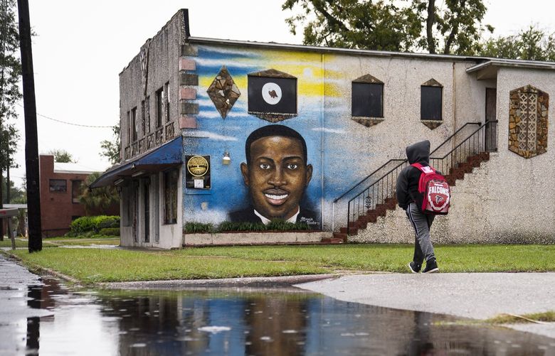 A mural of Ahmaud Arbery in Brunswick, Ga., as three white men were on trial for his killing, Nov. 5, 2021. The concurrent trials here and in Kenosha expose deep fault lines in the legal and moral concept of self-defense, a doctrine that is ill-equipped to handle an era of expanded gun rights. (Nicole Craine/The New York Times) XNYT64 XNYT64