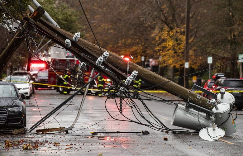 Downed utility pole off East Madison Street in Capitol Hill after heavy rain and strong winds came through the Seattle area Tuesday afternoon. A driver was trapped under the wire and rescued.

Nov. 9, 2021.

LO