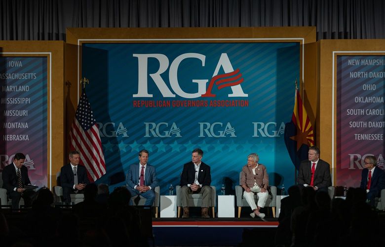 Gov. Doug Ducey of Arizona, left, with Gov. Bill Lee, of Tennessee, Gov. Brian Kemp, of Georgia, Gov. Mark Gordon, of Wyoming, Gov. Kay Ivey, of Alabama, Gov. Mike Dunleavy,  of Alaska and Gov. Mike DeWine of Ohio, during the Republican Governors Association meeting in Phoenix on Wednesday, Nov. 17, 2021. At the RGA meeting, governors privately discussed former President Donald Trumpâ€™s campaign of retribution against incumbent Republicans he dislikes. (Caitlin O’Hara for The New York Times) XNYT55 XNYT55