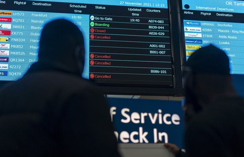 Travelers look a a board listing canceled flights at O.R. Tambo International airport in Johannesburg, Saturday, Nov. 27, 2021. One nation after another shut its doors to southern Africa over the weekend, even as they spurned public health measures that scientists said were far more urgently needed to take on the omicron variant of COVID. (Joao Silva/The New York Times)
XNYT34 XNYT34
