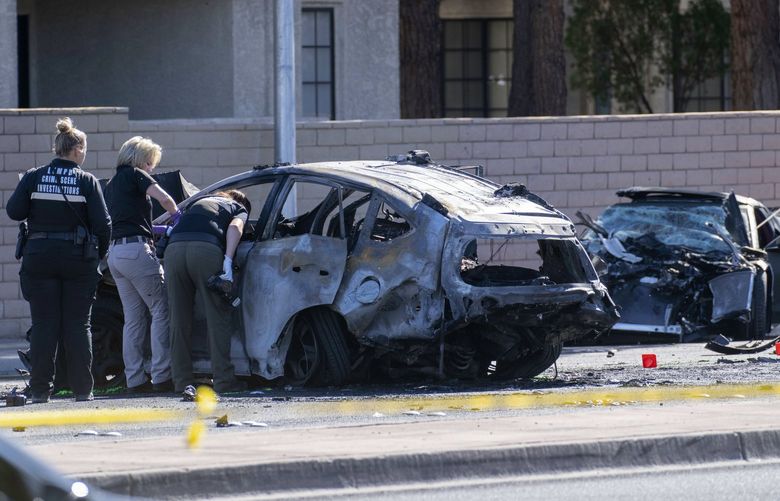Las Vegas Metro Police investigators work at the scene of a fatal crash Tuesday, Nov. 2, 2021, in Las Vegas. Police in Las Vegas say Las Vegas Raiders wide receiver Henry Ruggs III was involved in the fiery vehicle crash early Tuesday that left a woman dead and Ruggs and his female passenger injured. (AP Photo/Eric Jamison) NVJL108 NVJL108