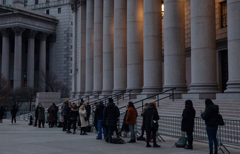 People wait to enter court in Lower Manhattan for Ghislaine Maxwell’s sex trafficking trial on Tuesday, Nov. 30, 2021. Maxwell is charged in federal court with trafficking women and girls for her longtime partner, Jeffrey Epstein, the disgraced financier who died in prison in 2019. (Dave Sanders/The New York Times) XNYT1 XNYT1