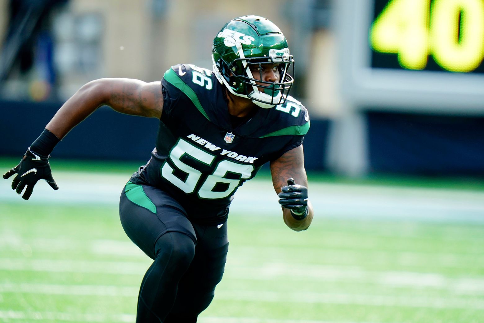 New York Jets linebacker Quincy Williams (56) reacts after