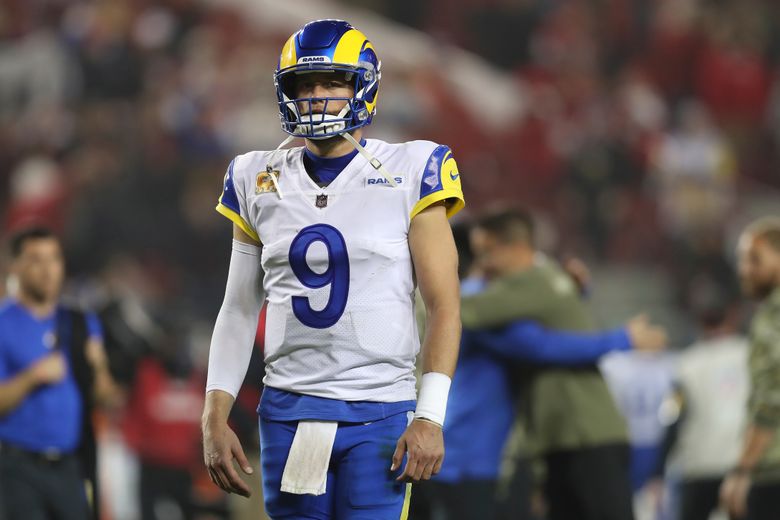 Matthew Stafford of the Los Angeles Rams looks on from the bench