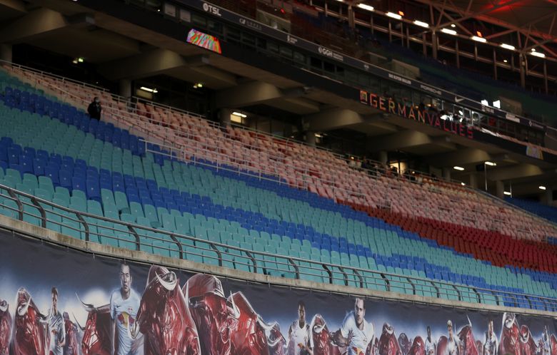 AP PHOTOS: Stadiums deserted as virus postpones opening day