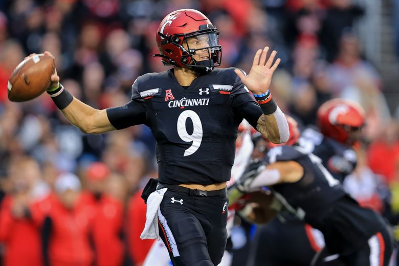 Quarterback Desmond Ridder of the Cincinnati Bearcats throws a pass