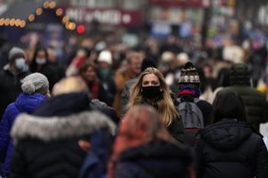 Shoppers do their last Christmas shopping in Leicester Square in London, on Wednesday. British Prime Minister Boris Johnson said that his government reserves the “possibility of taking further action” to protect public health as omicron spreads across the country. (AP Photo/Frank Augstein) 