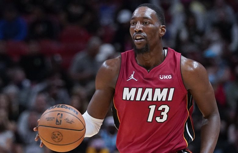 Miami Heat center Bam Adebayo takes the ball down court during the second half of an NBA basketball game against the Denver Nuggets, Monday, Nov. 29, 2021, in Miami. (AP Photo/Wilfredo Lee) NYOTK NYOTK