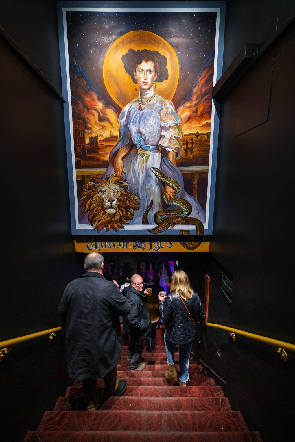 People head downstairs to Madame Lou’s at The Crocodile. (Dean Rutz / The Seattle Times)