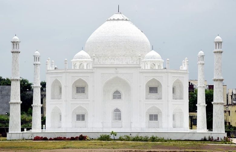 This undated photograph provided by Indian businessman Anand Prakash Chouksey shows a house resembling Indiaâ€™s iconic Taj Mahal monument built by Chouksey as a residence for him and his wife to live in at Burhanpur, Madhya Pradesh, India. Constructed with white marble procured from Makrana, a city in Rajasthan state and the same place that gave the Taj Mahal its marble, the smaller imitation embodies several aspects of the real monument, including the large dome, intricate minarets and even artwork seen on the original. ( Anand Prakash Chouksey via AP) ITR103 ITR103