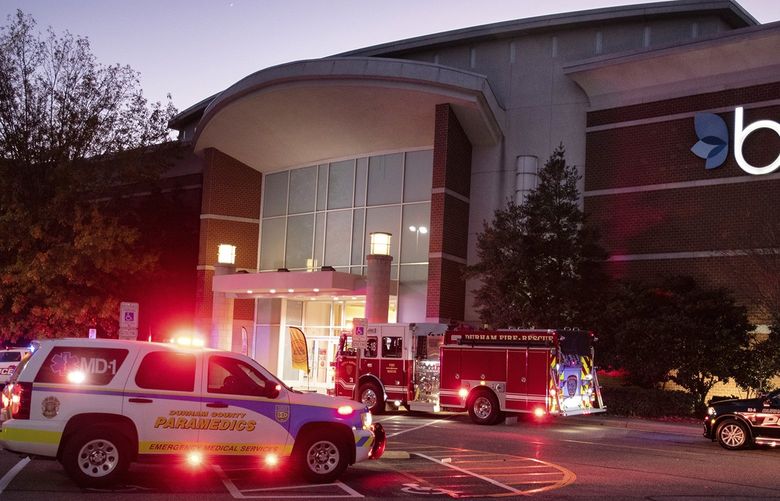 Emergency vehicles congregate around the entrance to Belk at The Streets of Southpoint Mall in Durham, North Carolina, after three people, including a 10-year-old, were wounded in an afternoon shooting on Black Friday, Nov. 26, 2021. (Scott Sharpe/Raleigh News & Observer/TNS) 33359901W 33359901W