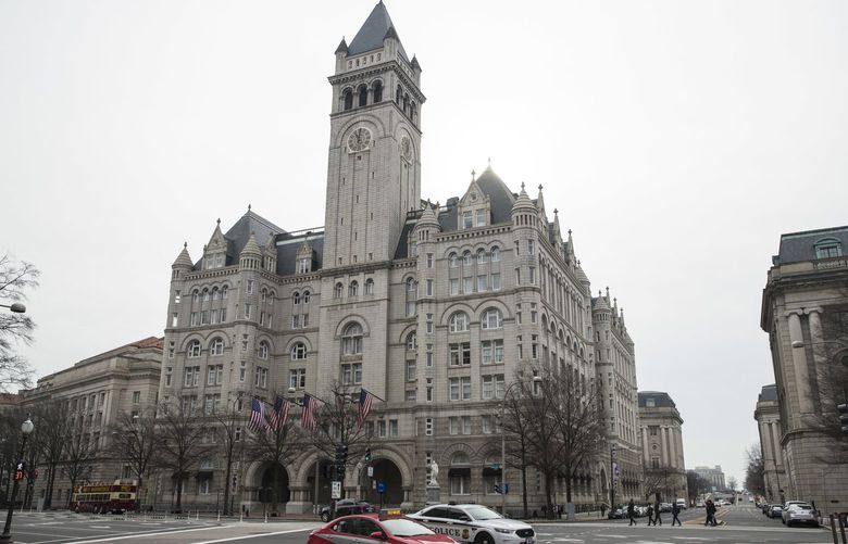 The Old Post Office Pavilion Clock Tower, which remains open during the partial government shutdown, is seen above the Trump International Hotel, Friday, Jan. 4, 2019 in Washington. (AP Photo/Alex Brandon)