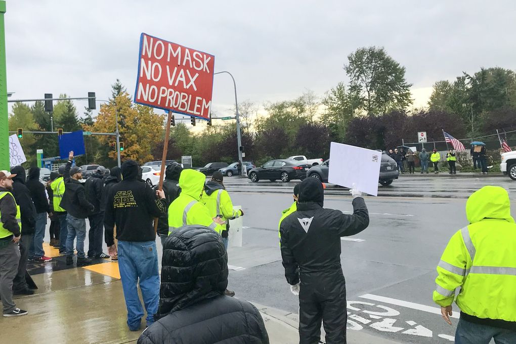 Boeing workers protest against the jet-maker’s vaccine requirement in Everett in October. (Dominic Gates / The Seattle Times)