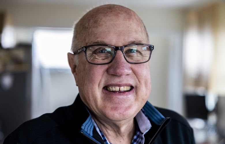 Weatherman Larry Schick, also known as the “Powder Poobah,” in his home in the Magnolia neighborhood in Seattle on Thursday, Dec. 2, 2021. Schick is in his 25th year of snow forecasting and has been a well regarded figure in the ski and snowboard community.