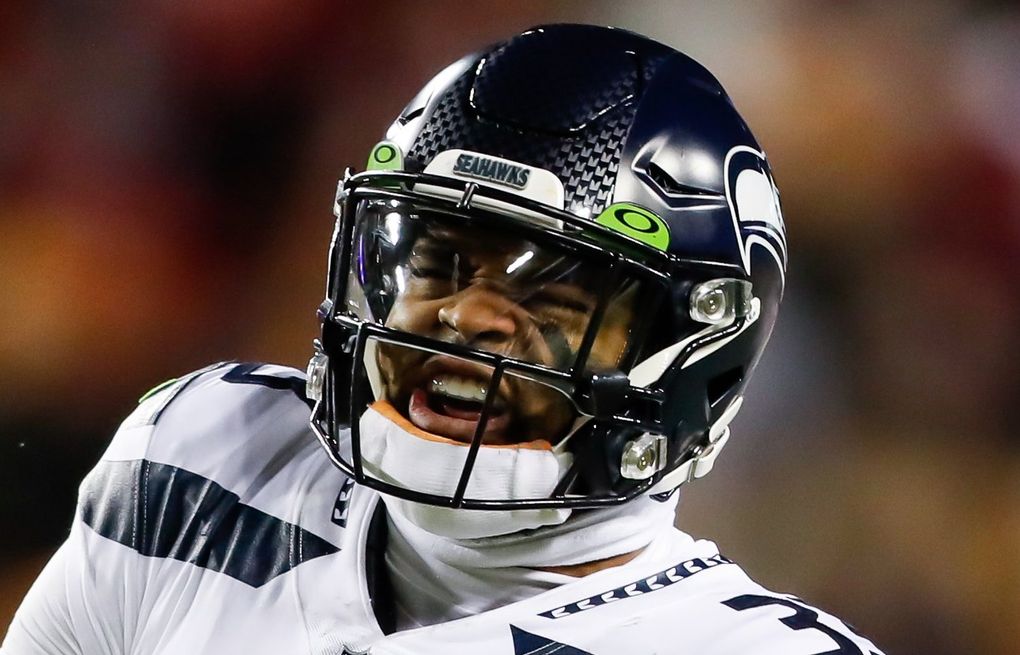 Seattle Seahawks' Carlos Dunlap on Russell Wilson: 'He told me he's with us  and he's here to stay' 