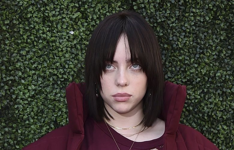 Billie Eilish arrives at the Variety 2021 Music Hitmakers Brunch at City Market Social on Saturday, Dec. 4, 2021, in Los Angeles. (Photo by Jordan Strauss/Invision/AP) CAJS376 CAJS376