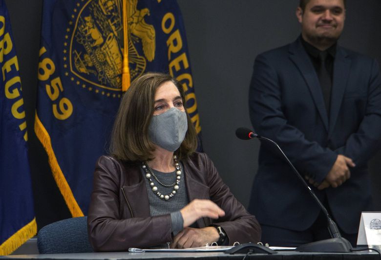 Oregon Gov. Kate Brown attends a news conference in November 2020 in Portland, Oregon.  (Cathy Cheney / The Associated Press)