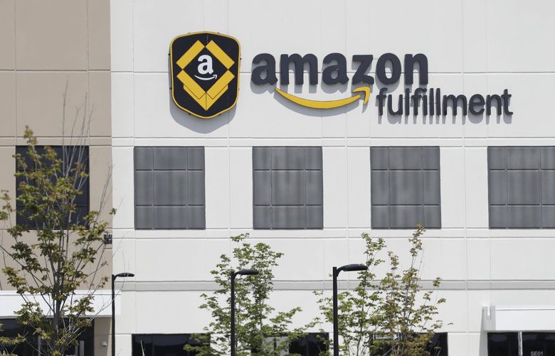 General scenes outside the Amazon Fulfillment center in Robbinsville Township, N.J., Tuesday, Aug. 1, 2017. Amazon held a nation-wide job fair at its warehouses on Aug. 2. (AP Photo/Julio Cortez) NJJC20