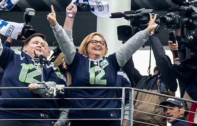 Jody Allen the owner of the Seattle Seahawks and sister of the late Paul Allen, waves to the crowd after raising the 12th Man Flag as the Seattle Seahawks take on the Los Angeles Rams at CenturyLink Field in Seattle Thursday October 3, 2019.  211692