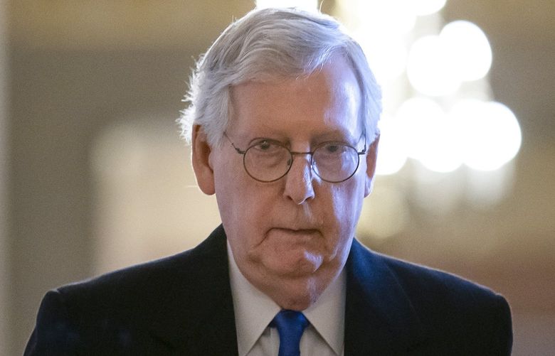 Senate Minority Leader Mitch McConnell, R-Ky., walks to the chamber as work continues on the process to raise the debt limit, at the Capitol in Washington, Thursday, Dec. 9, 2021. (AP Photo/J. Scott Applewhite) DCSA108 DCSA108